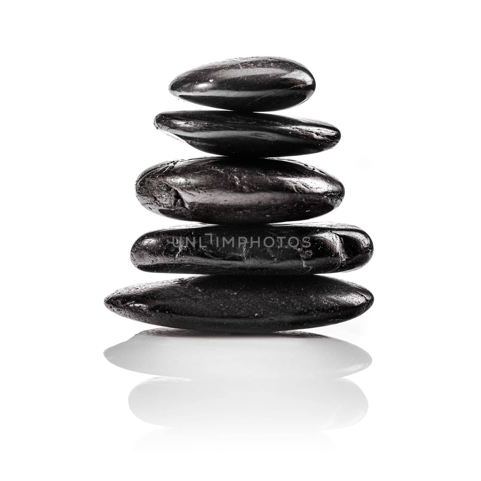 A Staple Massage or Zen Stones isolated on white for wellness concepts.