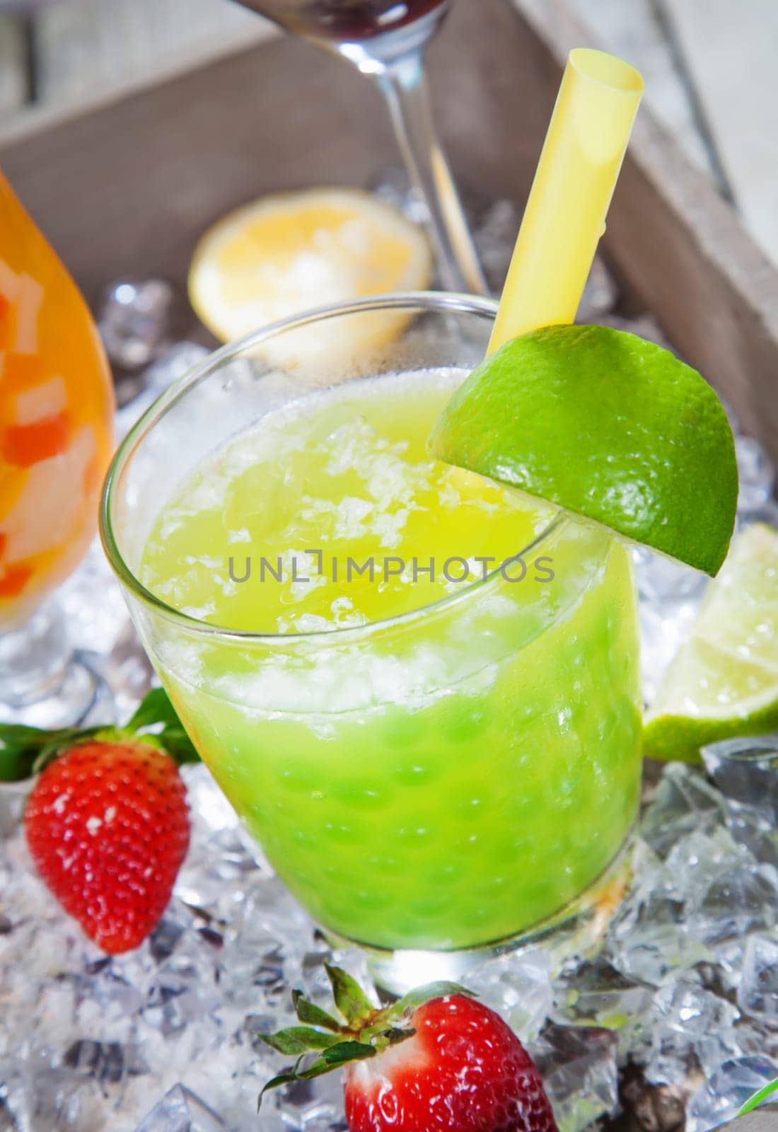Fresh Lime pearl tea Cocktail standing on a bed of crushed ice