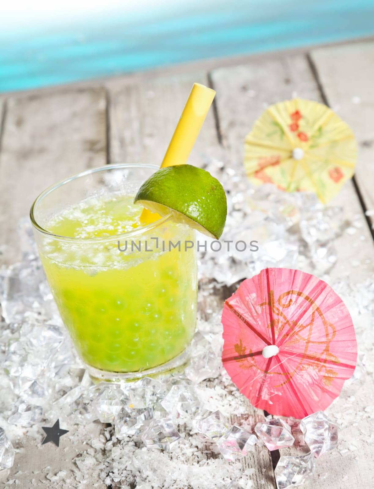Citrus flavored Pearl Tea refreshment on a deck in front of the pacific ocean