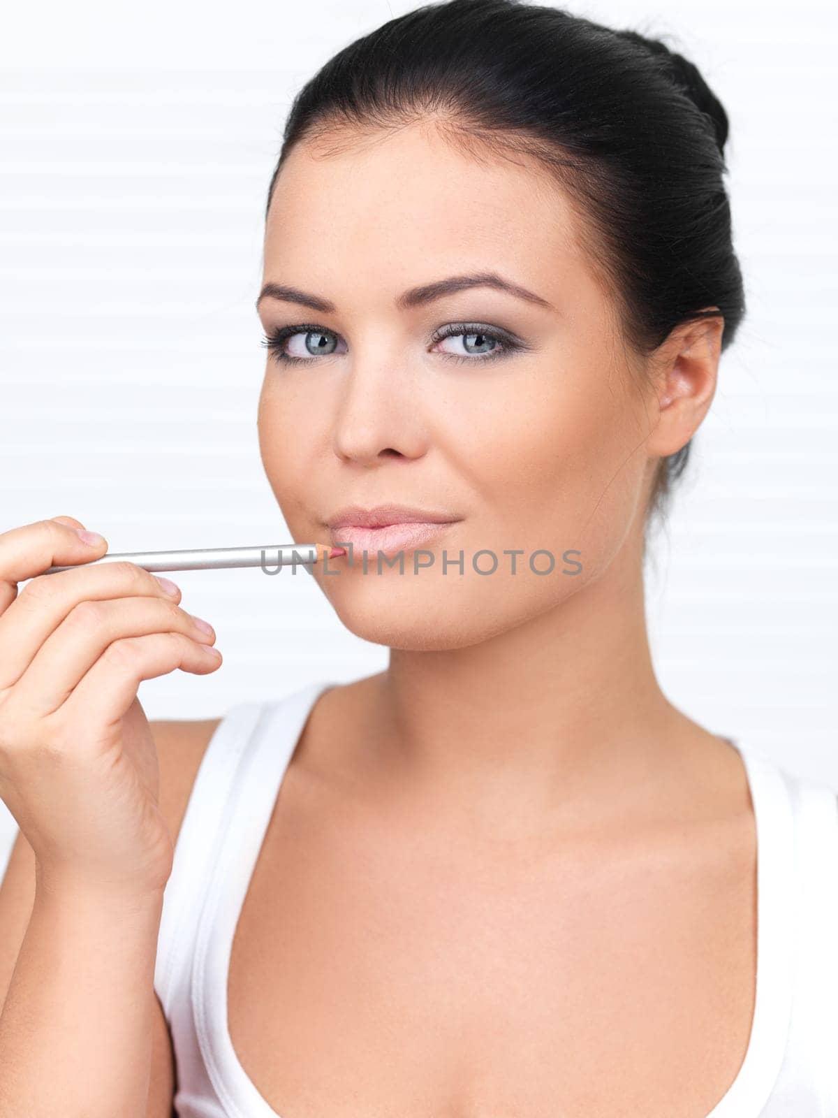 Portrait of beautiful woman, she doing makeup