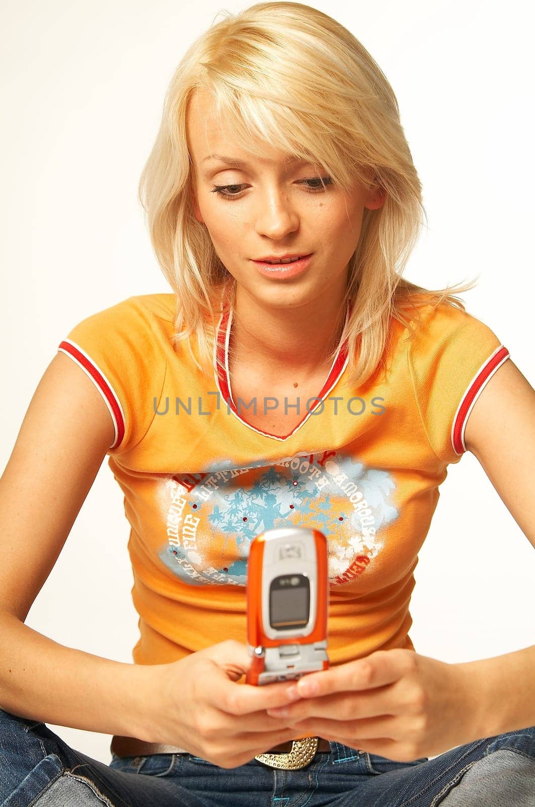 Pretty young women talking cell phone. Isolated on white background.