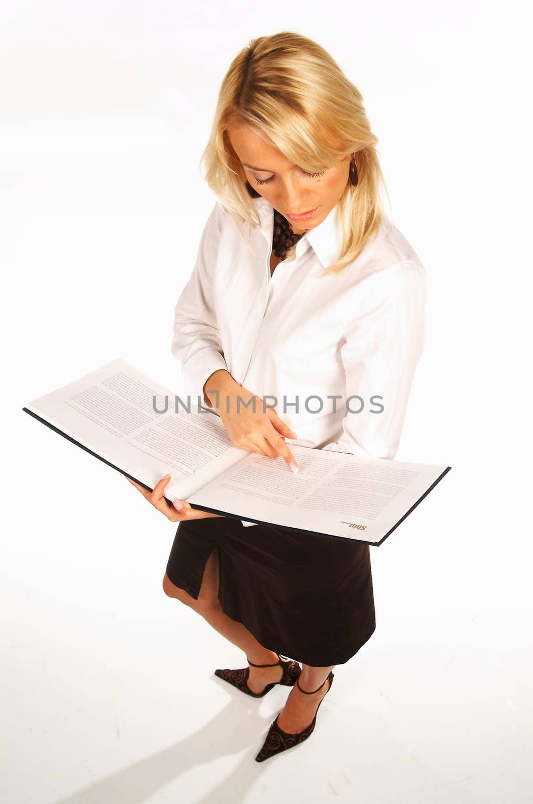 Sexy business women isolated on white holding book