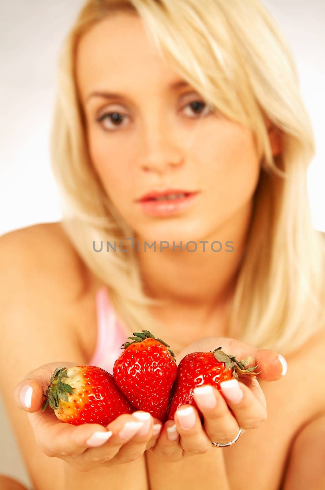 Young Blonde woman with fruits : Strawberry