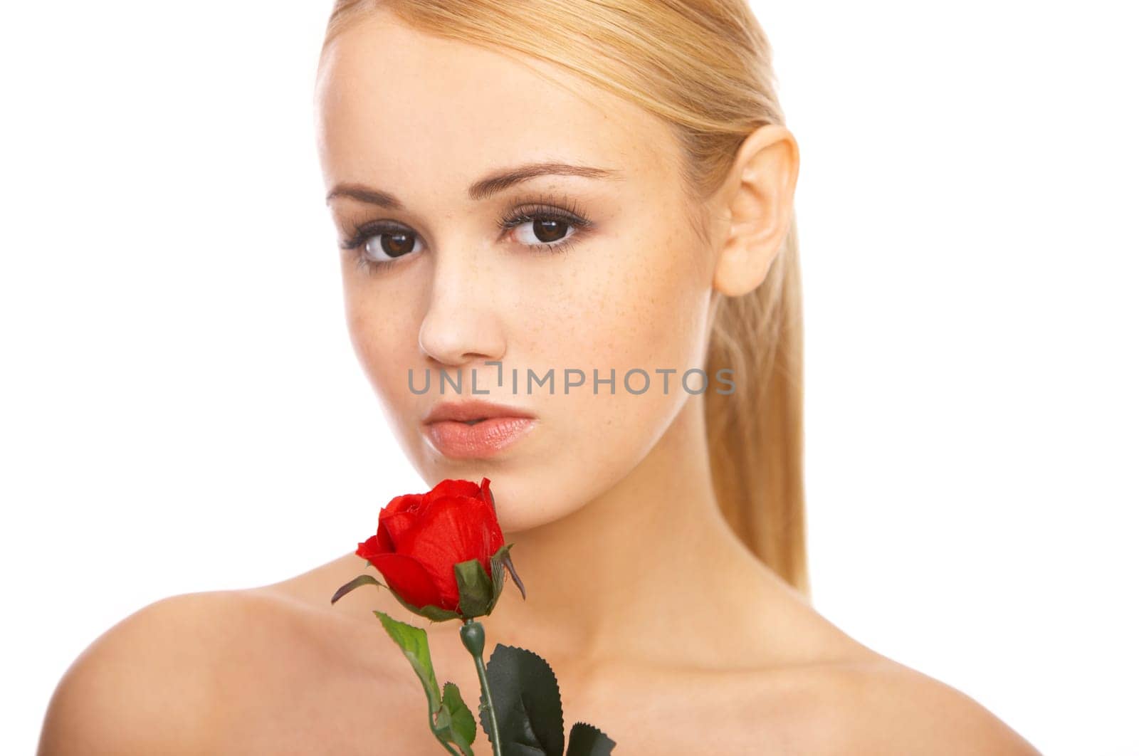 Portrait of cute blond woman, holding red rose