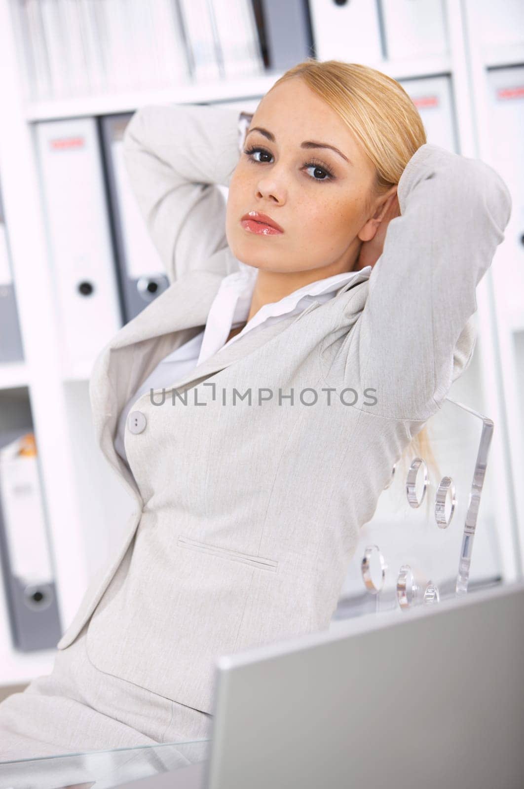 Young Beautiful business woman relaxing in office