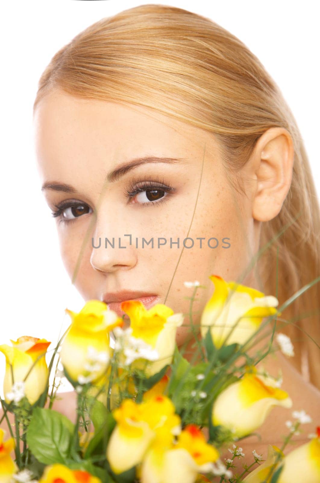 Portrait of cute blond woman, holding bunch of roses