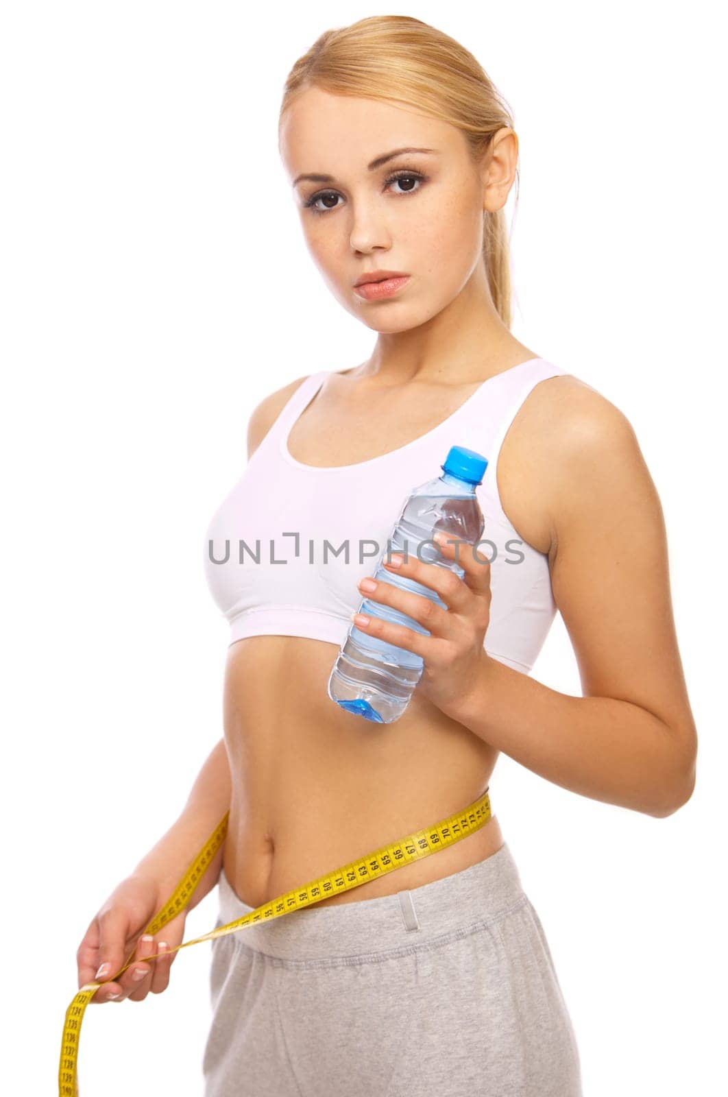 Portfait of Sporty beautiful girl holding bottle of water