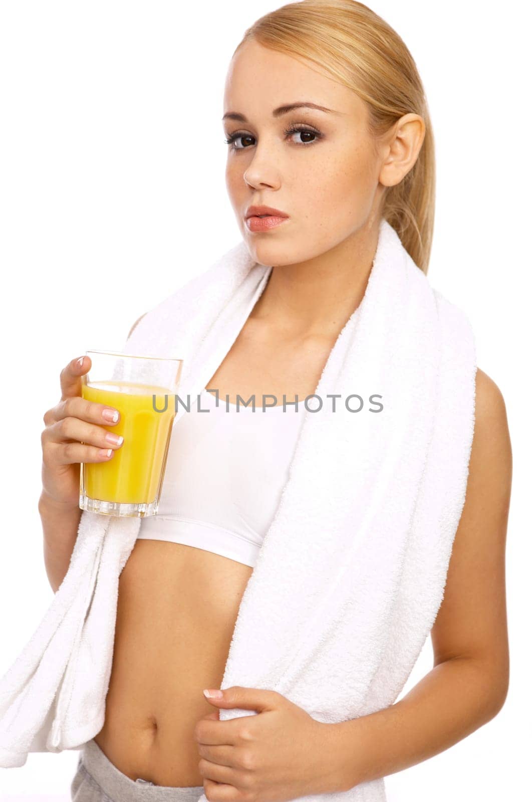 Portfait of Sporty beautiful girl holding glass of juice