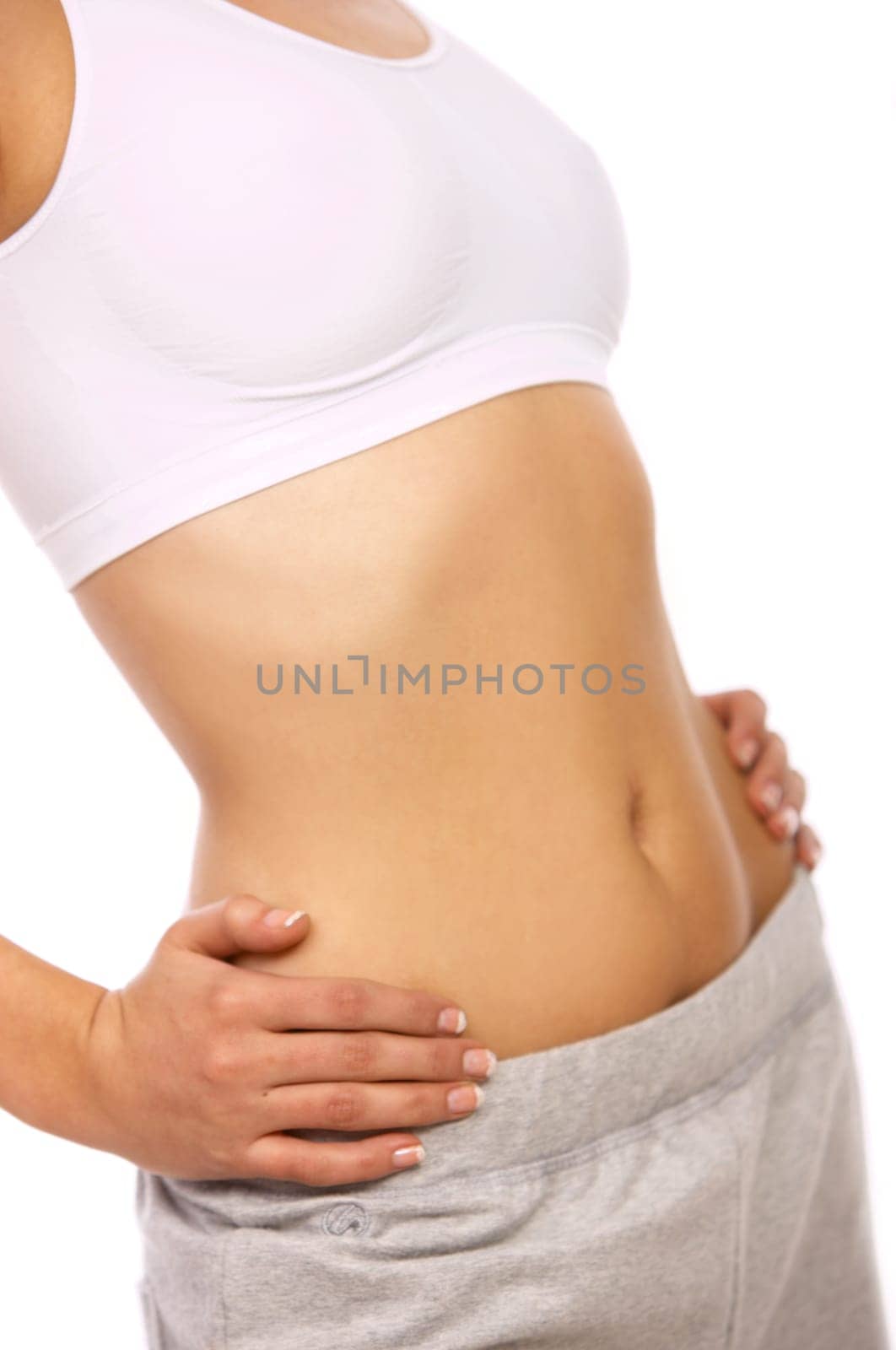 Part of Sporty beautiful girl standing on white