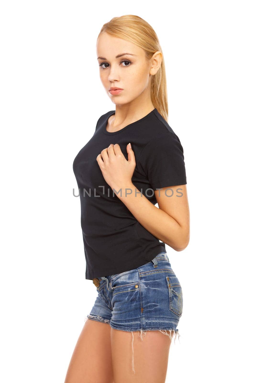 Portrait of a nice looking girl wearing shorts, on white