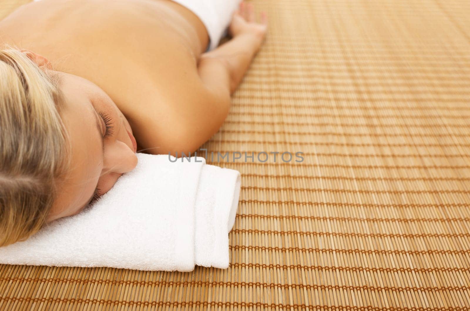 Portrait of Beautiful woman laying on bamboo mat