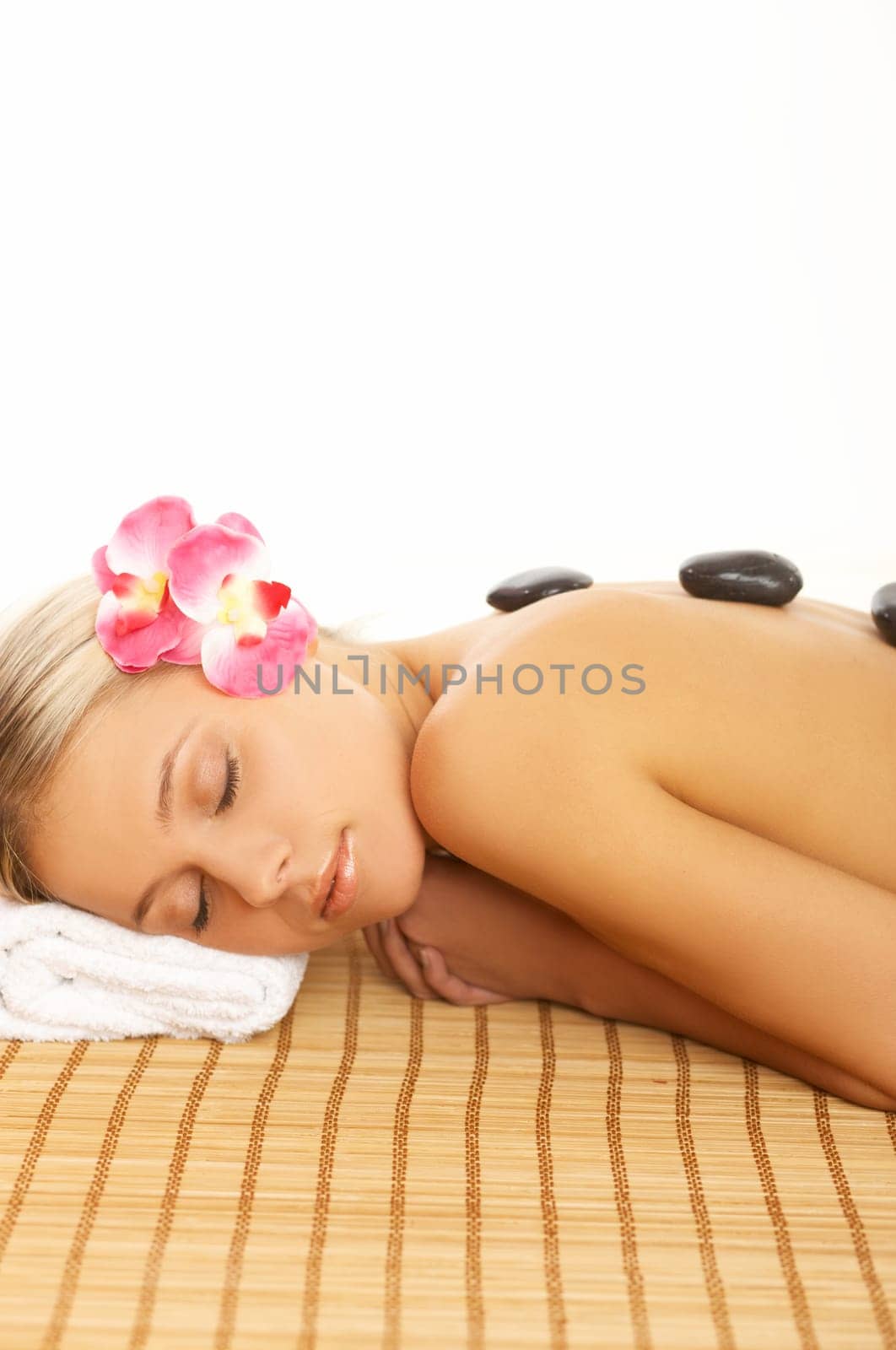 Portrait of Beautiful woman laying on bamboo mat