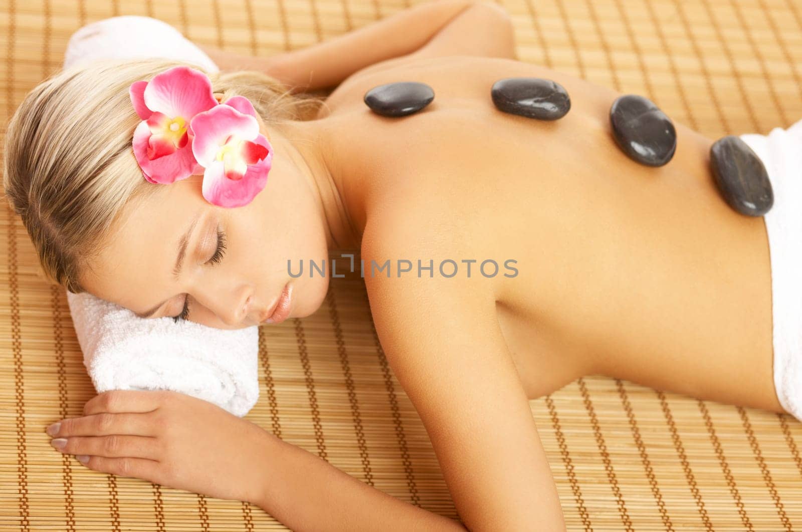 Portrait of Beautiful woman laying on bamboo mat