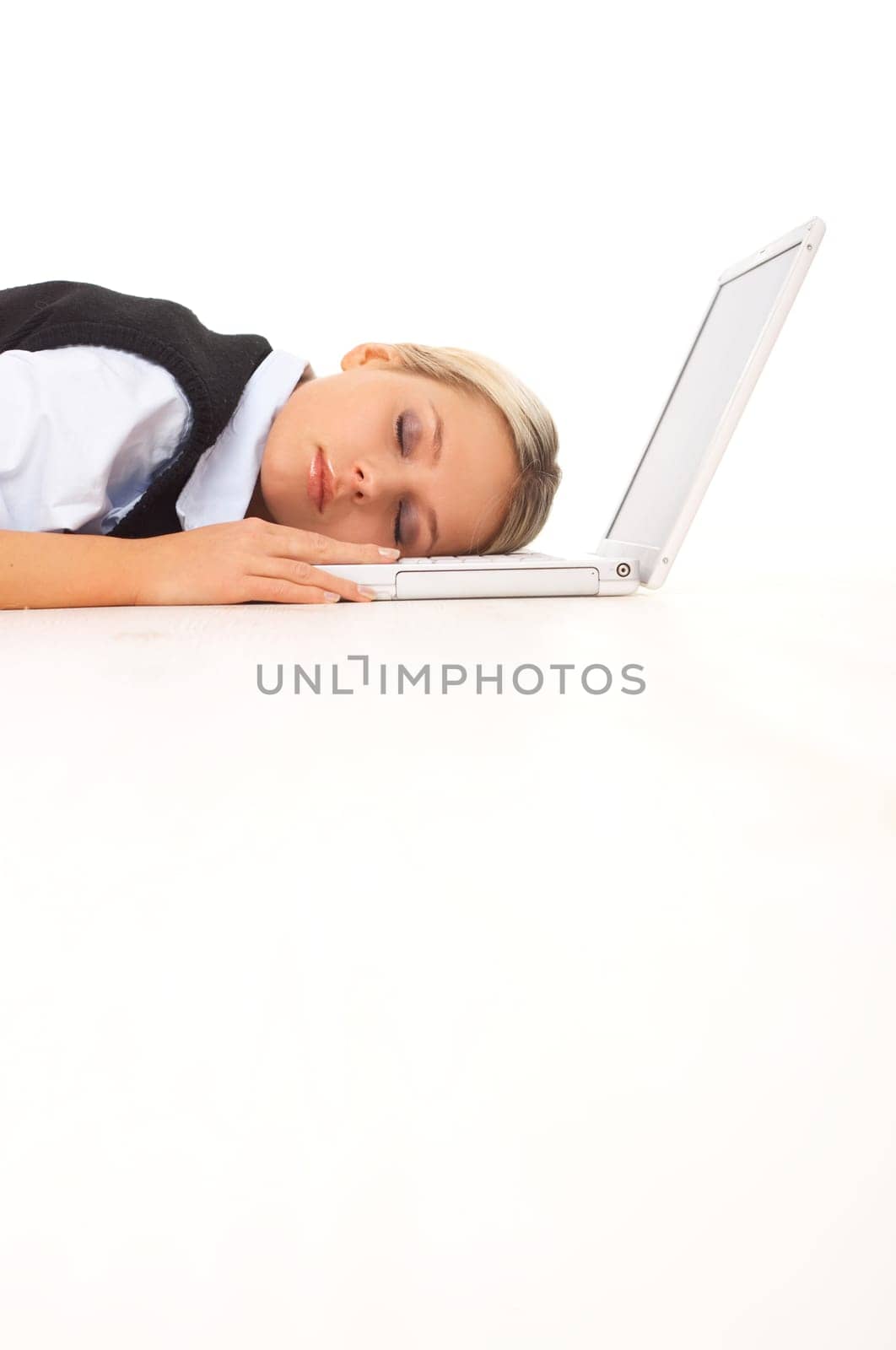 Very tired Businesswoman sleeping on her laptop while lying down on the floor