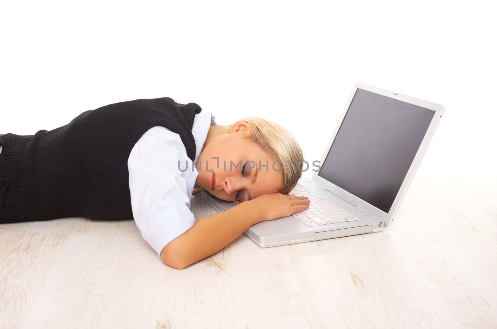 Overworked Businesswoman is sleeping on her laptop