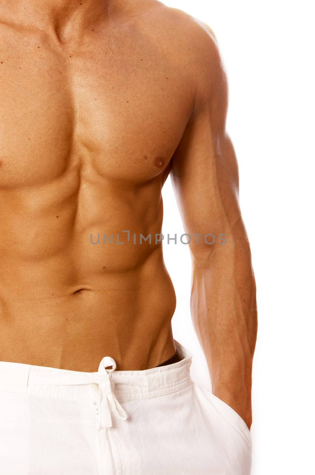 Muscular and tanned male torso isolated on white