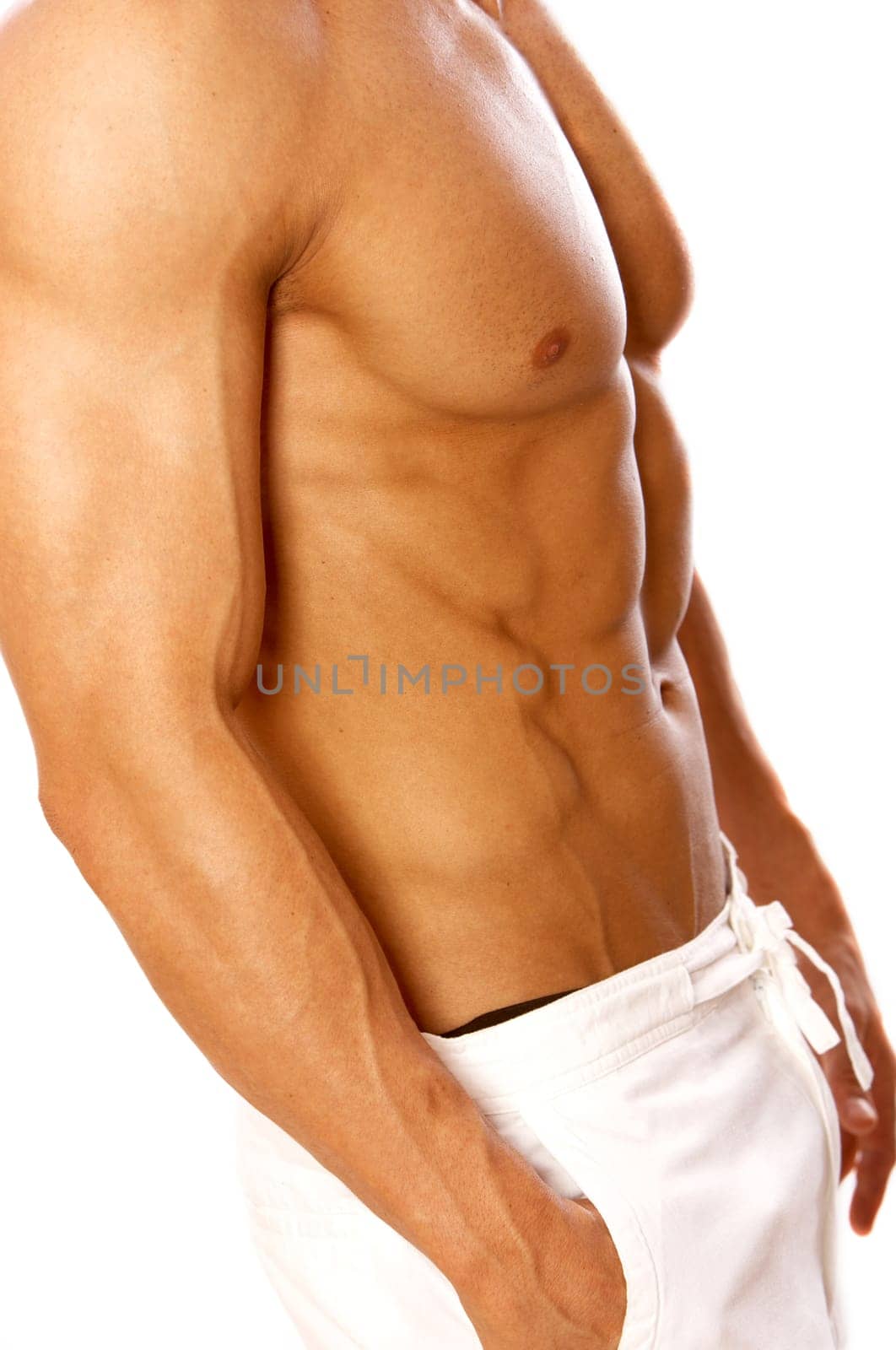 Muscular and tanned male isolated on white
