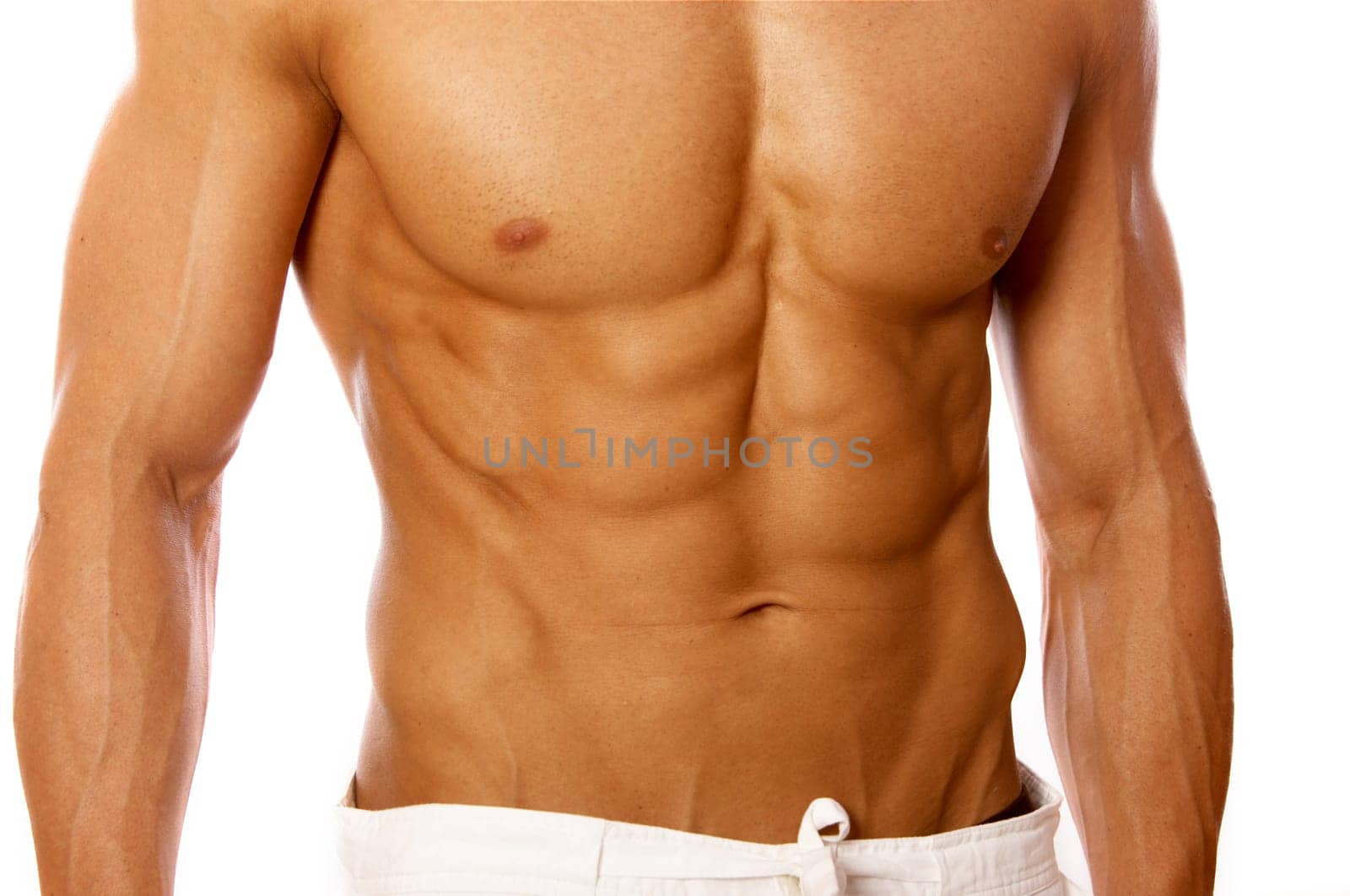 Muscular and tanned male isolated on white