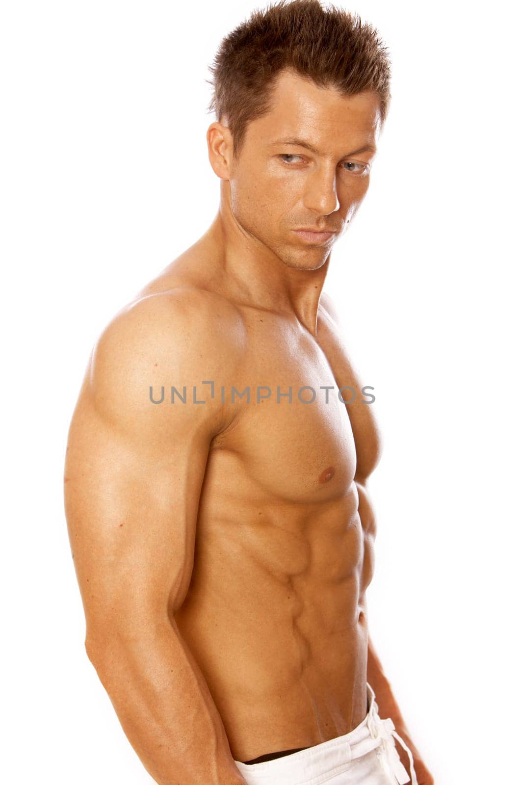 Muscular and tanned male isolated on white