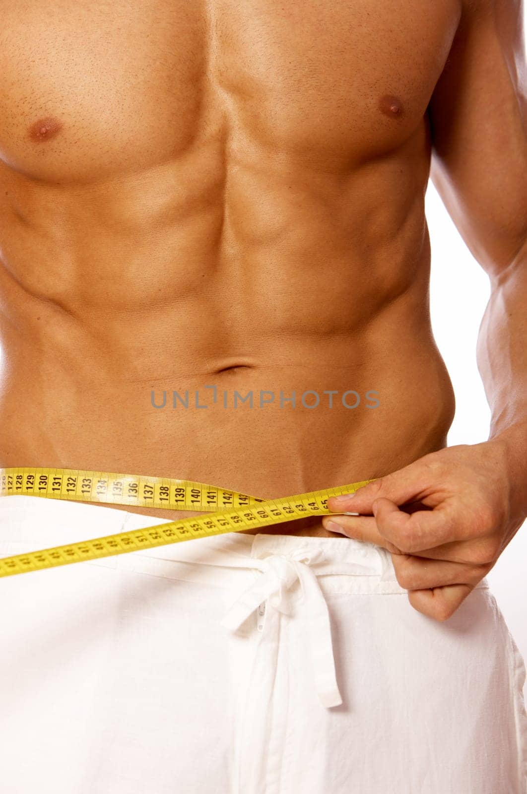 Muscular and tanned male body parts is being measured