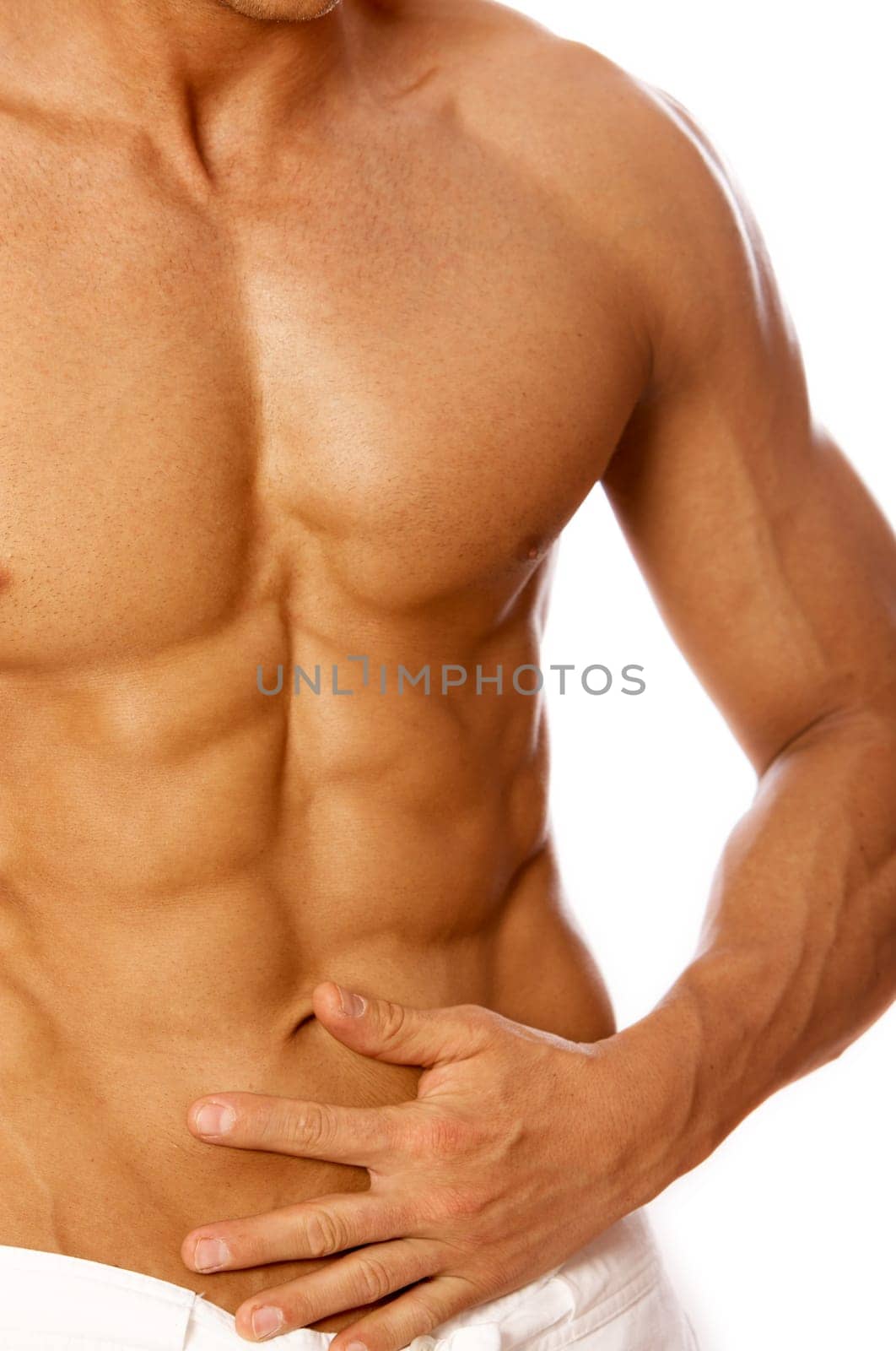 Muscular and tanned male torso isolated on white