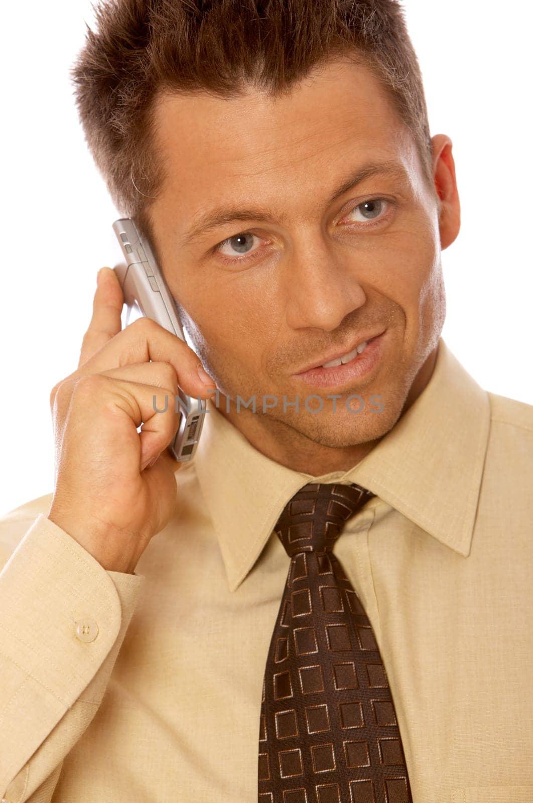 Portrait of handsome businessman is talking cell phone