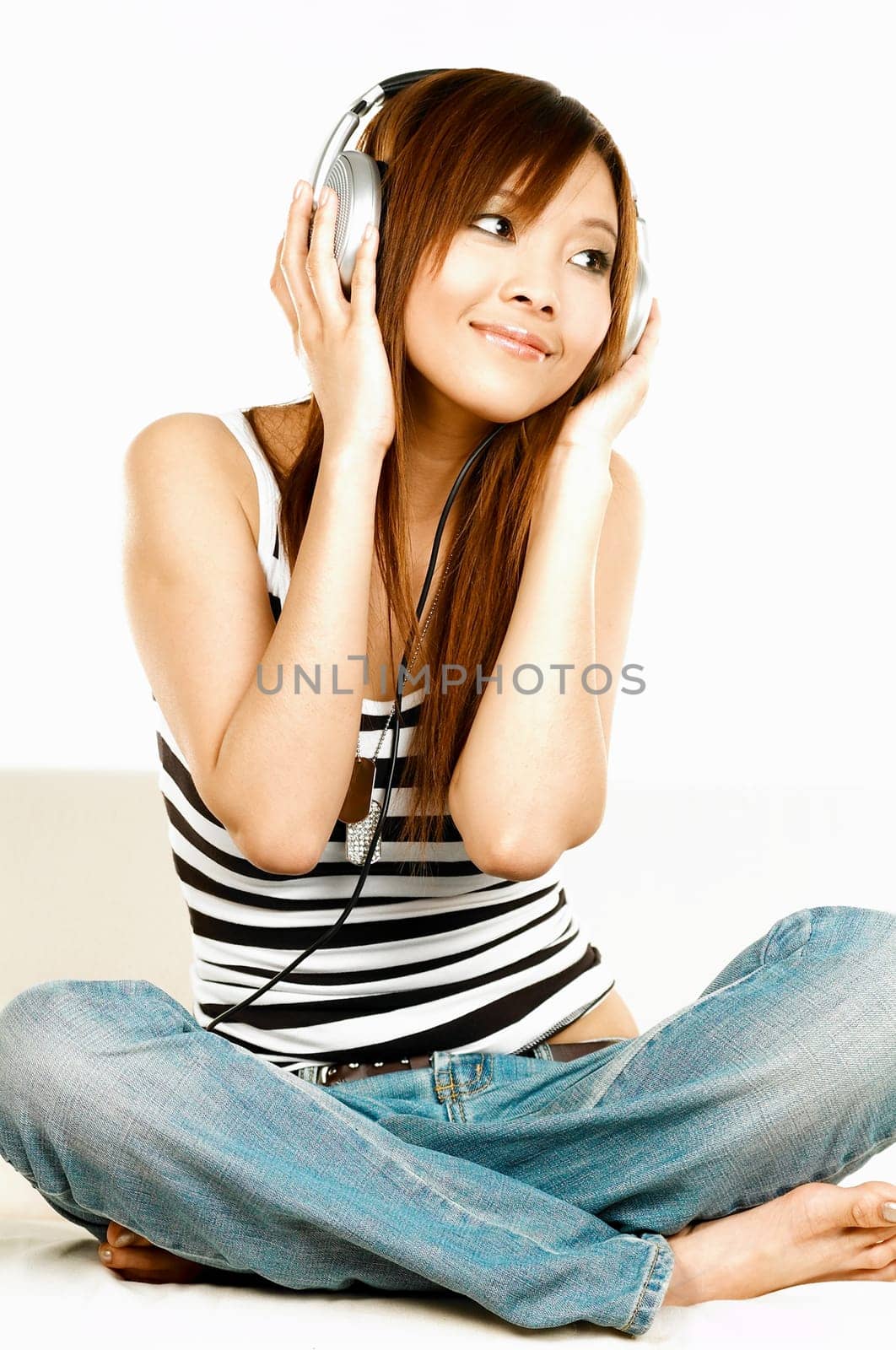 Young asian beautiful women is listening to the music