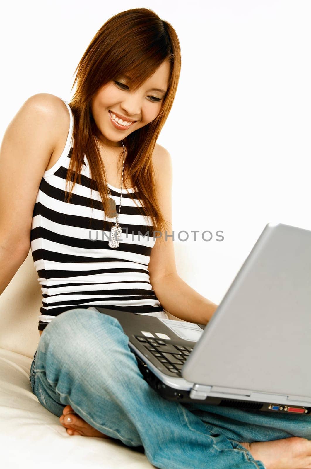 A young beautiful asian women working with her laptop computer