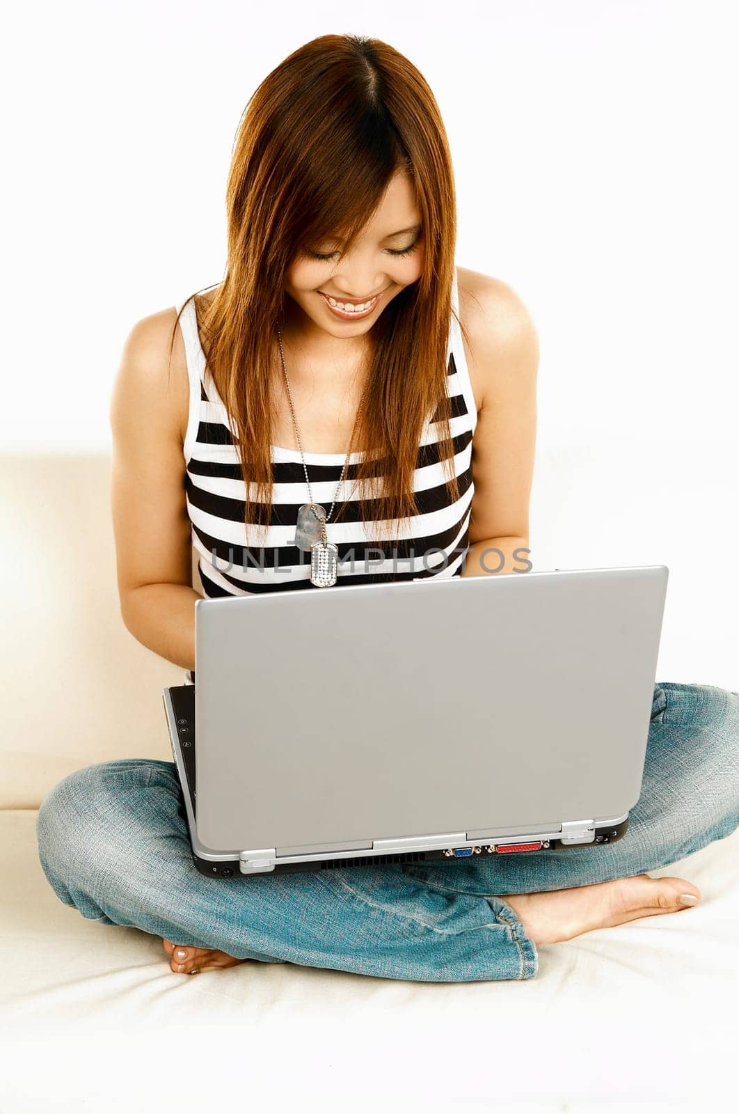 A young beautiful asian women working with her laptop computer