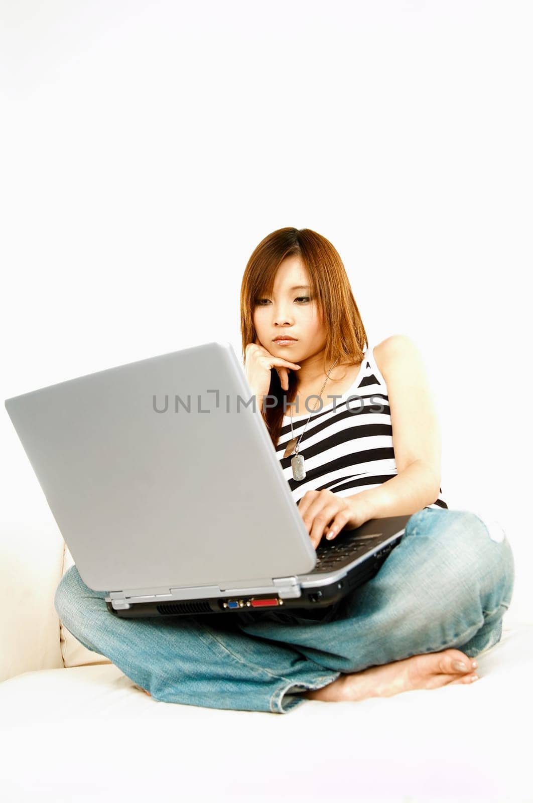 A young beautiful asian women working with her laptop computer