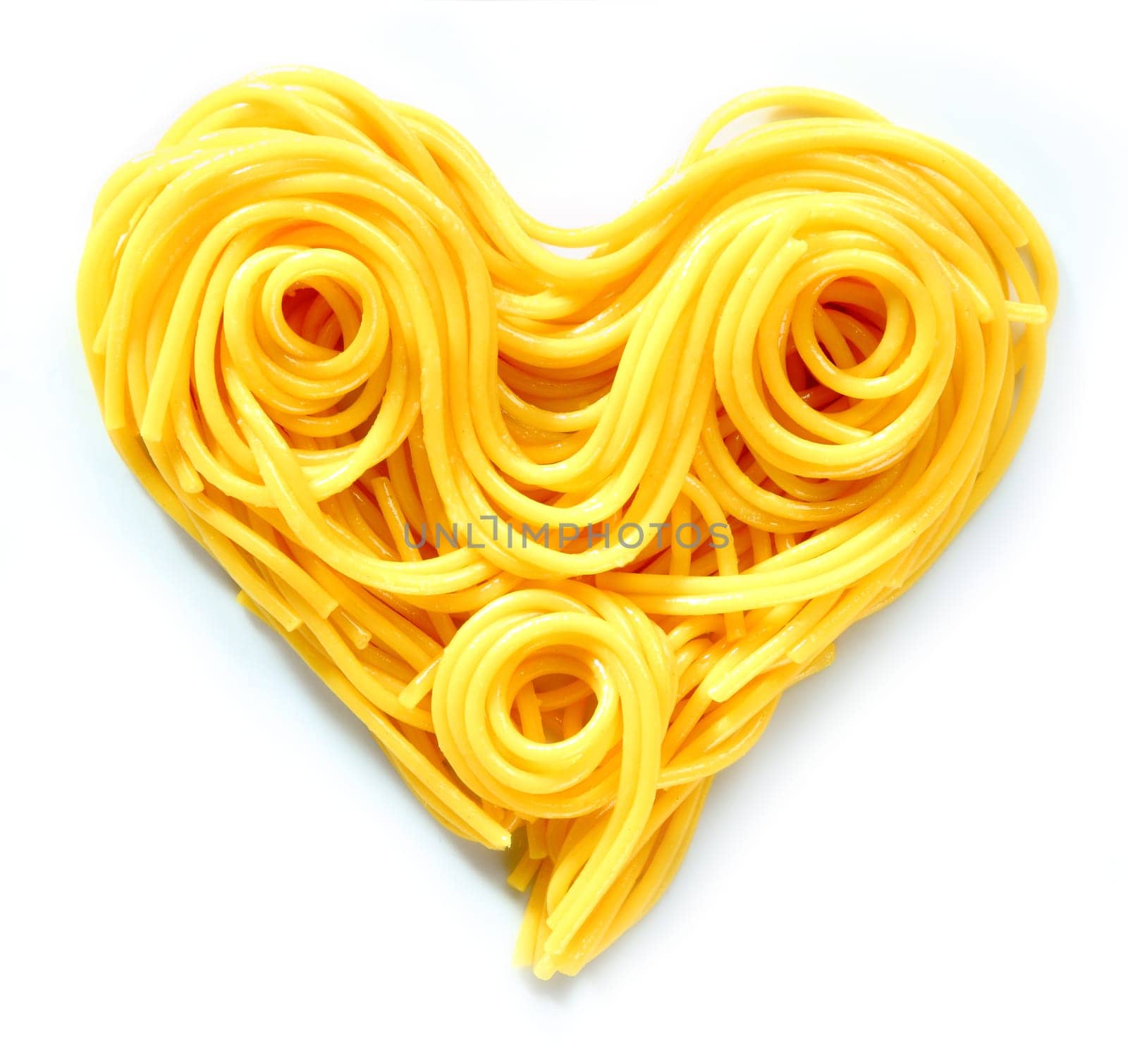 Beauty Pasta Heart. Heart-shaped arrangement of pasta, or spaghetti, isolated on white, concepetual of love and romance.