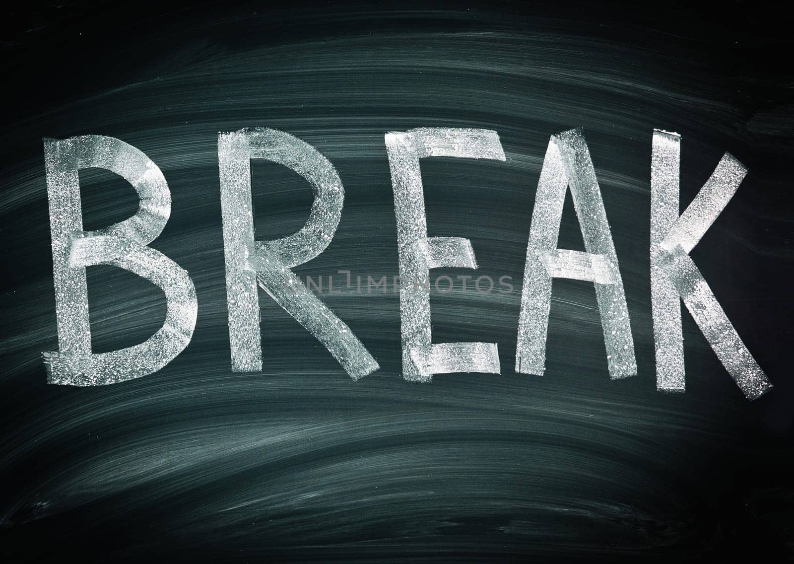 Break written boldly in chalk across a blackboard