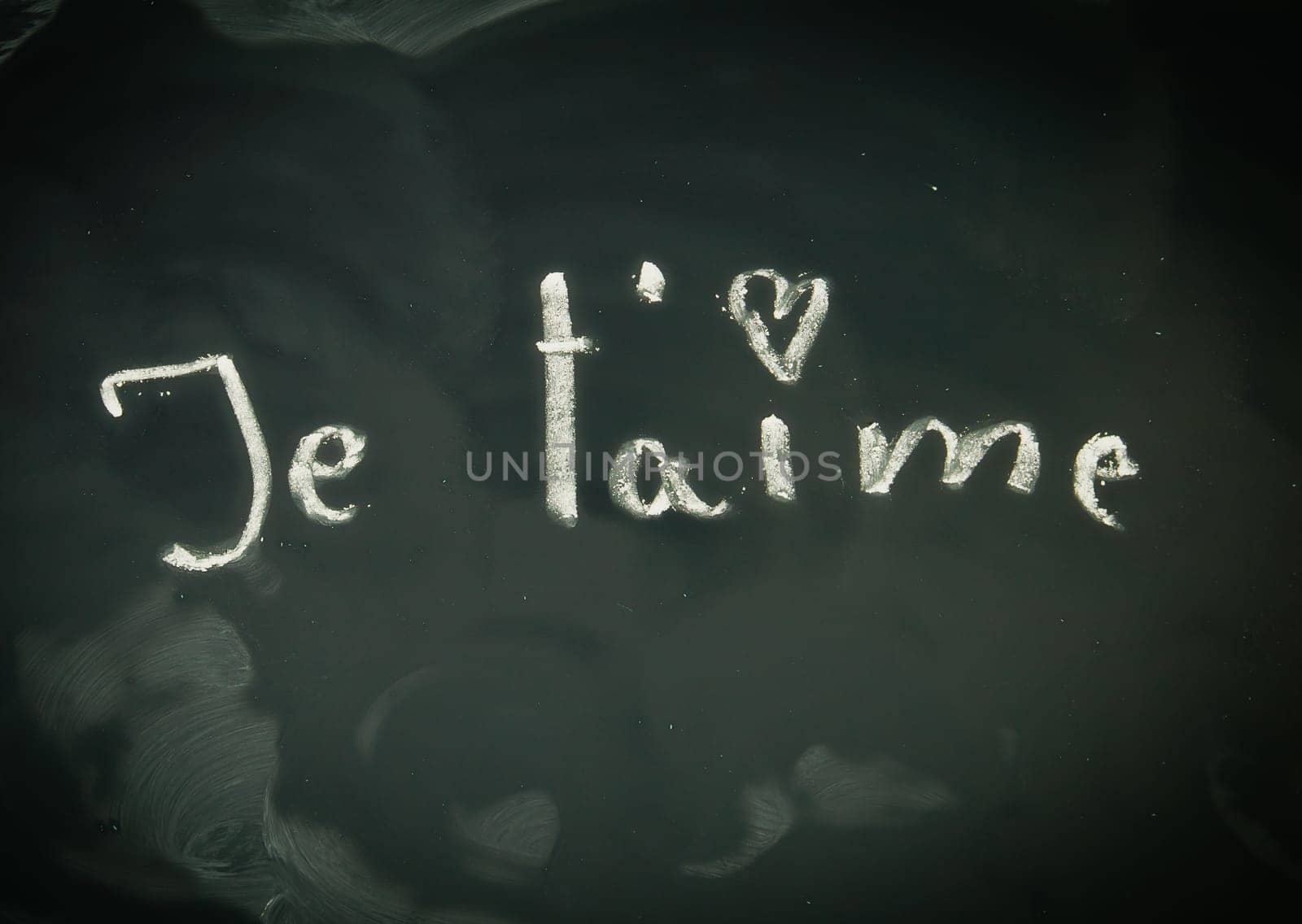 Chalk notes on a blackboard written in French