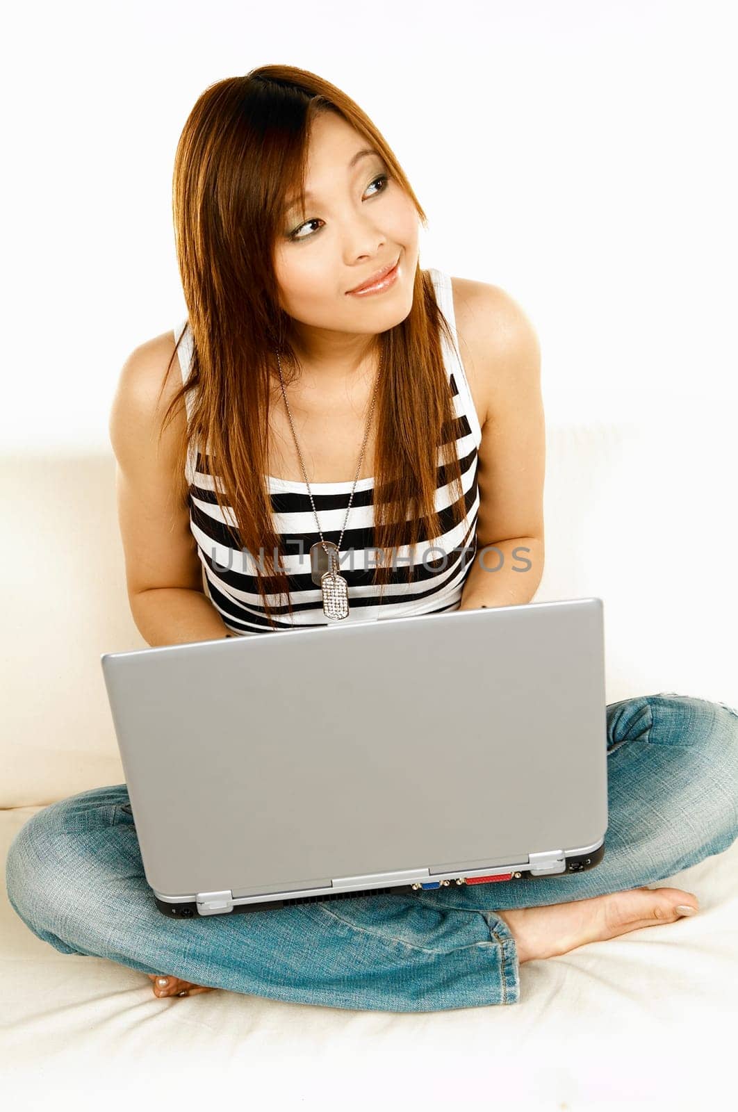 A young beautiful asian women working with her laptop computer