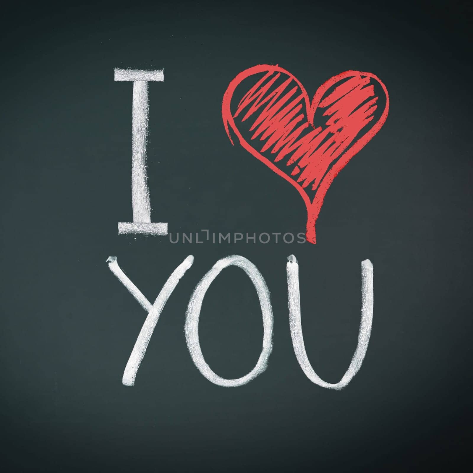 I Love You. Handwritten message on a chalkboard with an illustrated heart used as a symbol of love in this Valentines message.