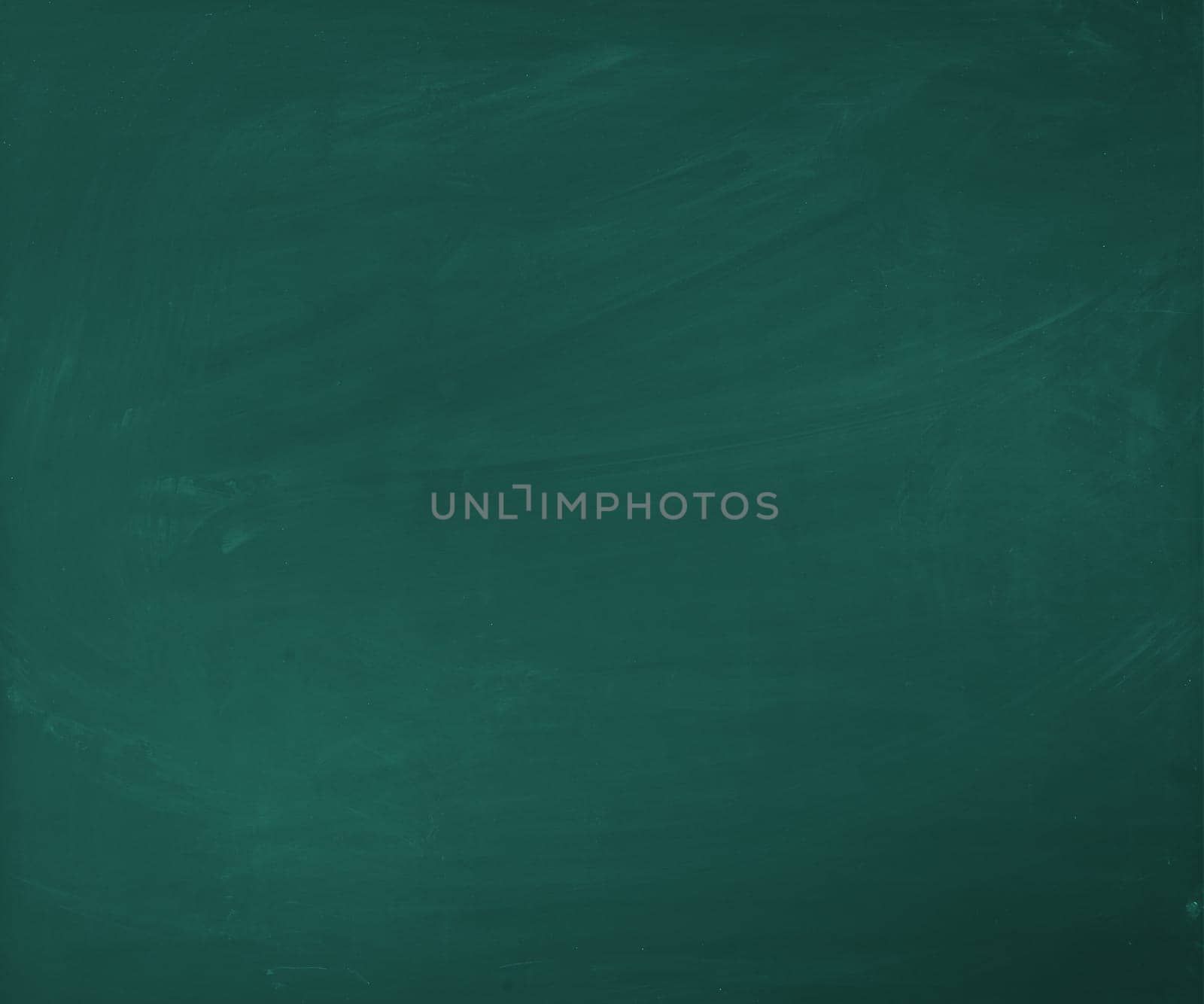 An empty green blackboard, a little bit dirty, for your own presentation