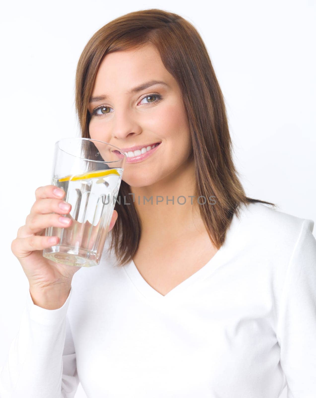Portrait of beautiful young woman with glass of water