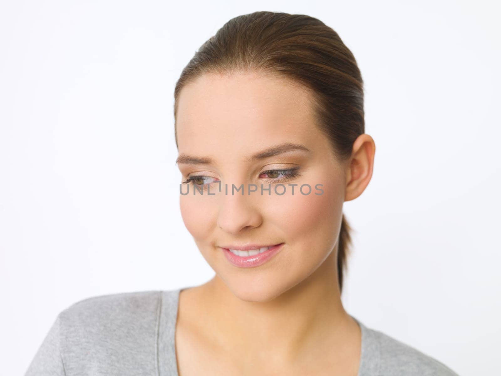 Portrait of beautiful young woman on white background