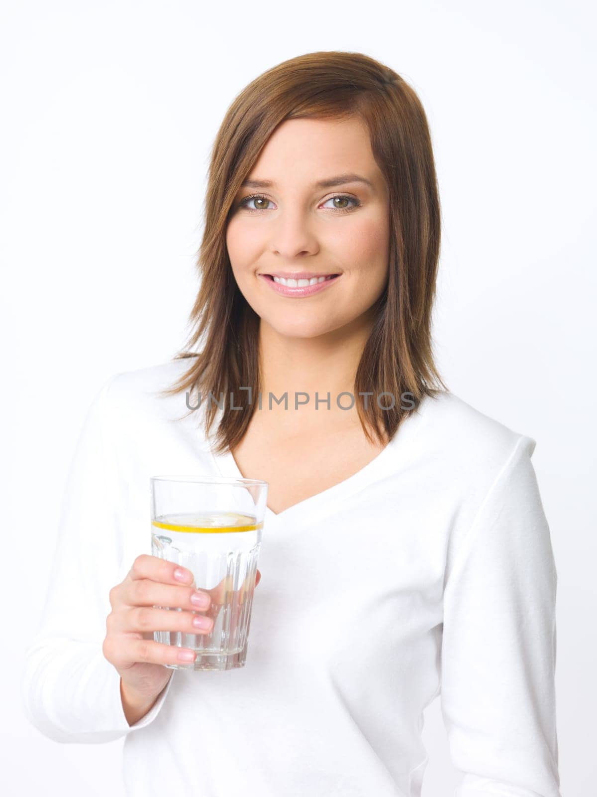 Portrait of beautiful young woman with glass of water