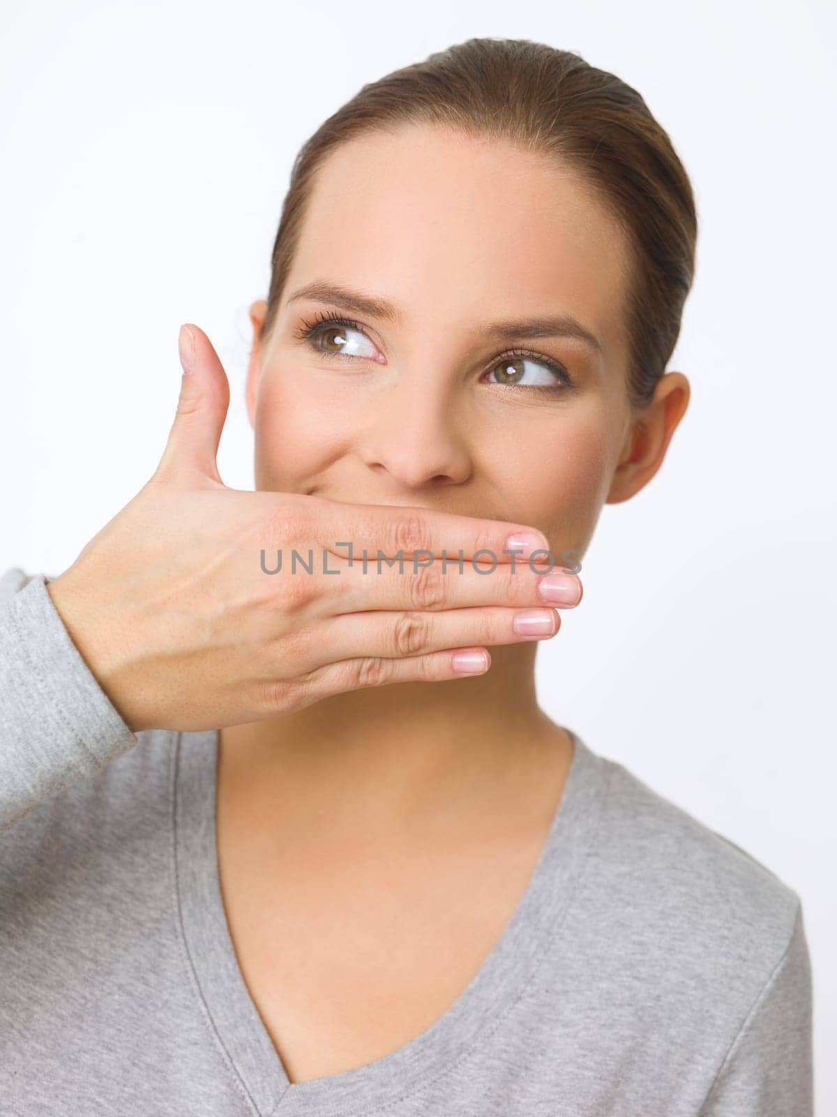Portrait of beautiful young woman showing surpise gesture