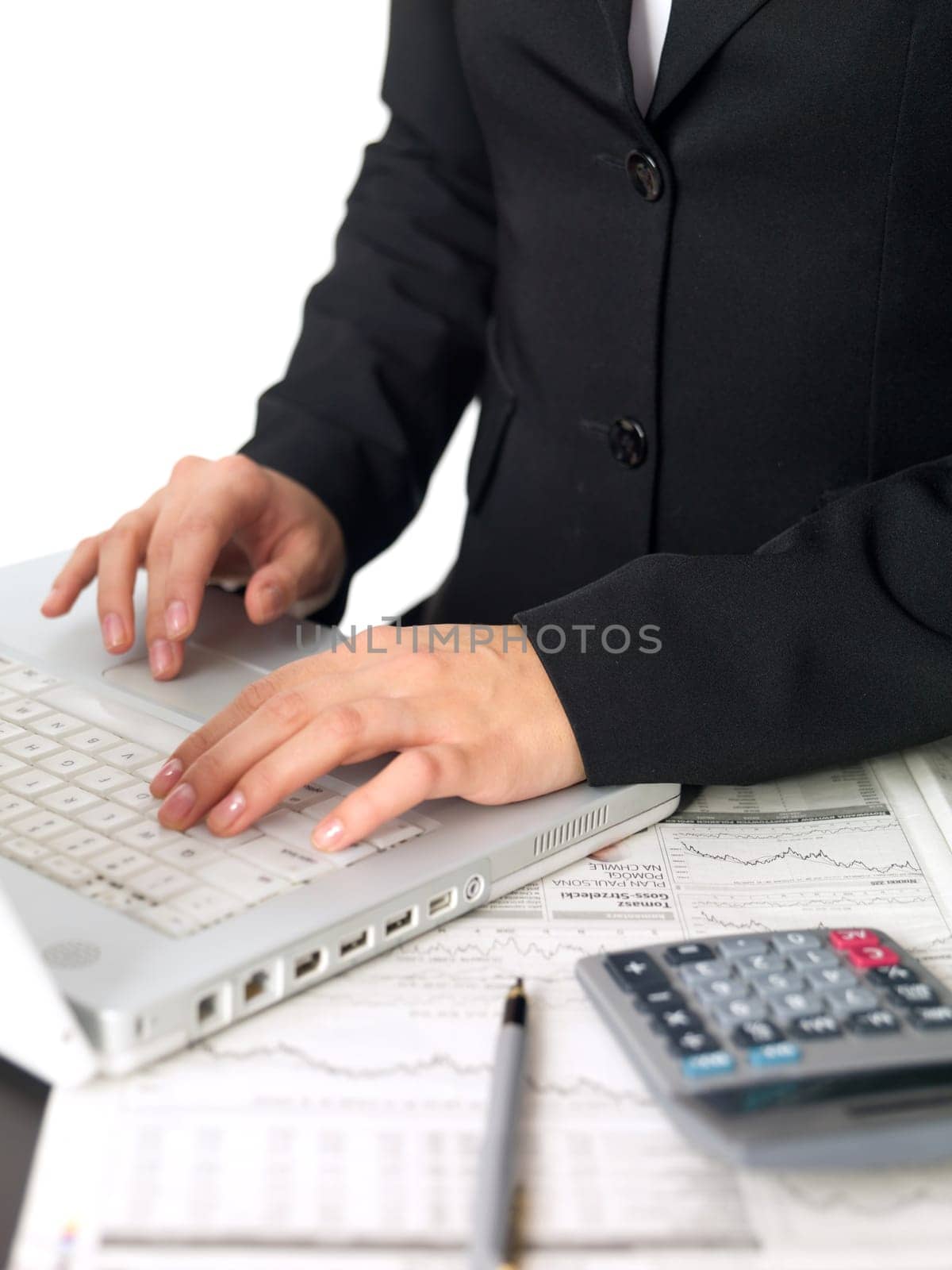 Portrait of beautiful and young business woman working on laptop