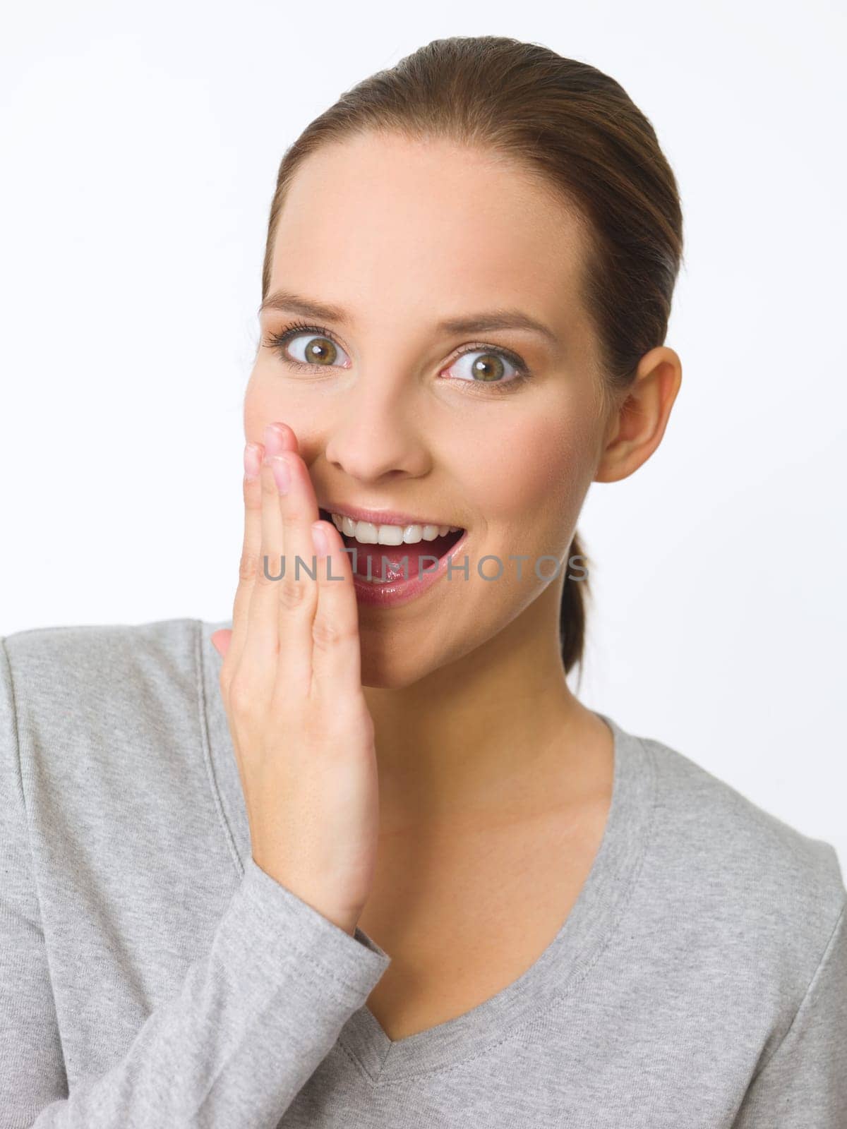 Portrait of beautiful young woman showing surpise gesture