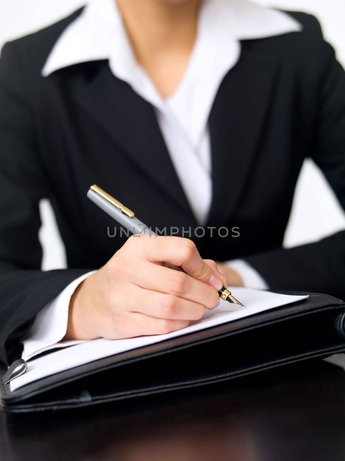 Portrait of beautiful and young business woman working at the desk