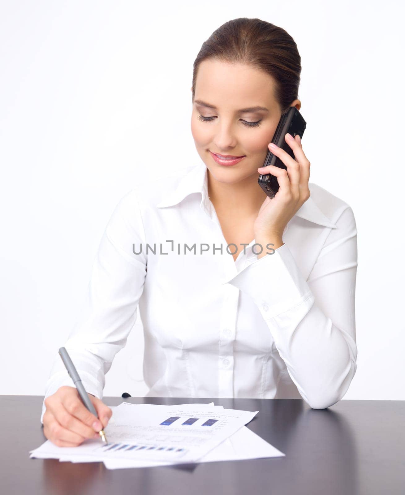Portrait of beautiful and young business woman using cell phone