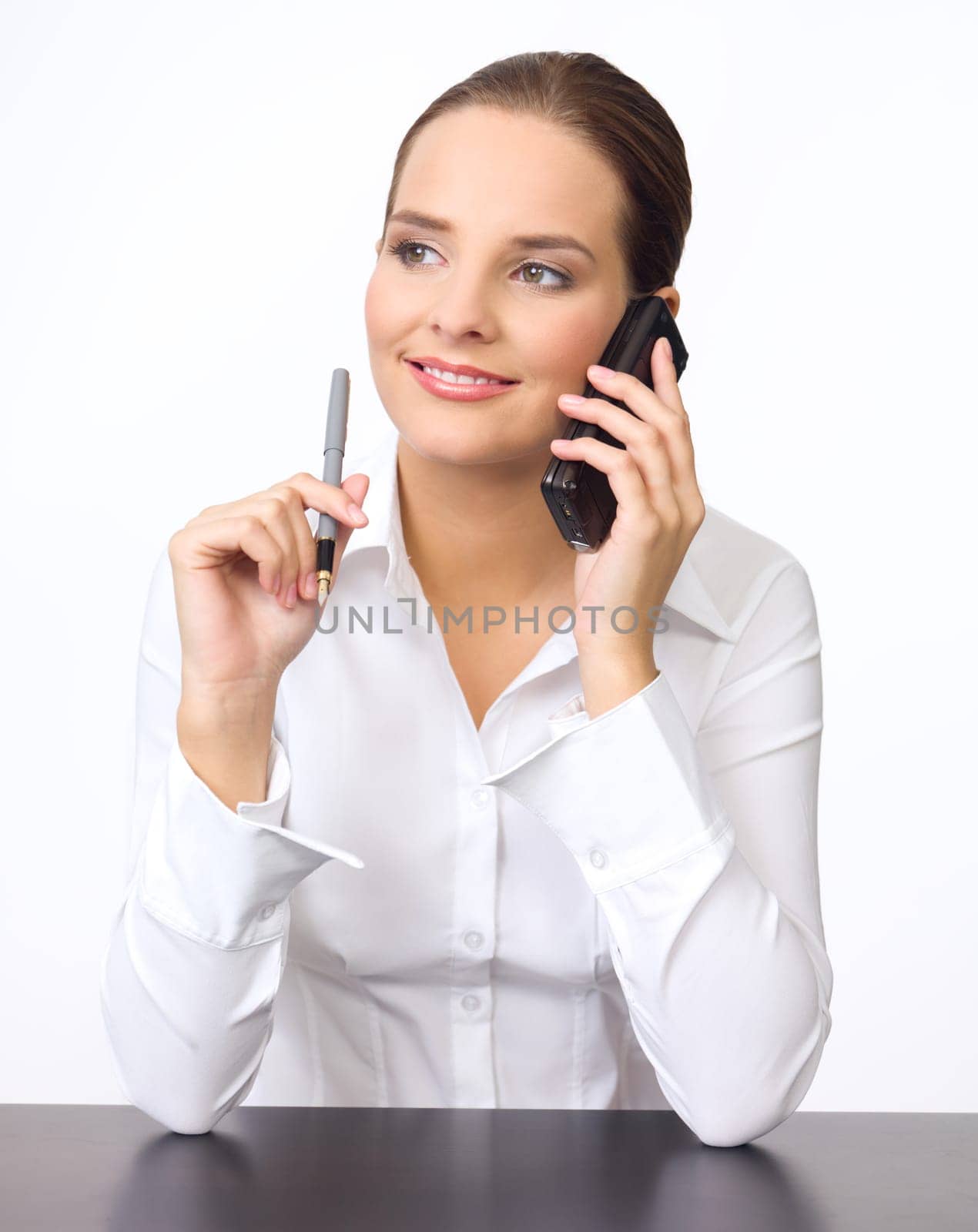 Portrait of beautiful and young business woman using cell phone