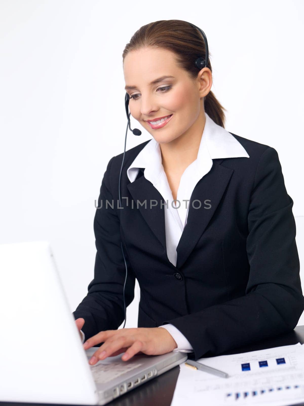 Portrait of beautiful and young business woman with headphones
