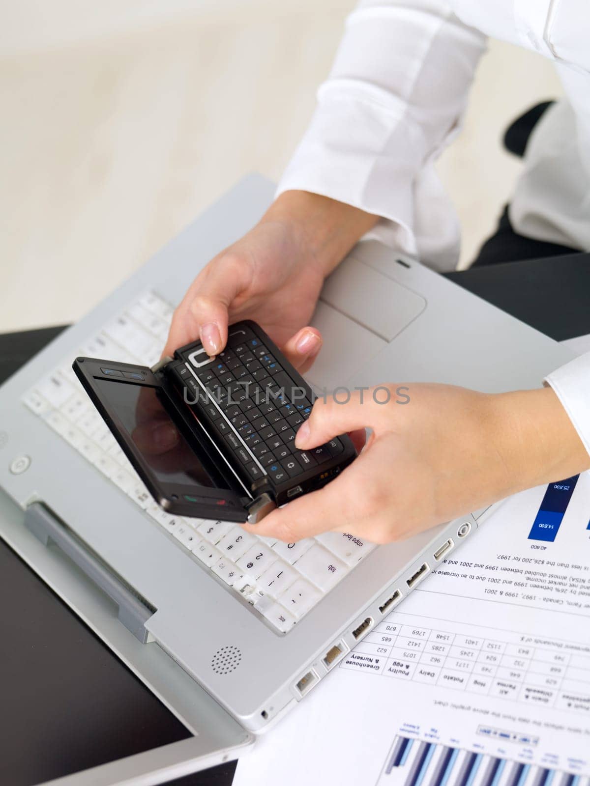 Portrait of beautiful and young business woman working on laptop
