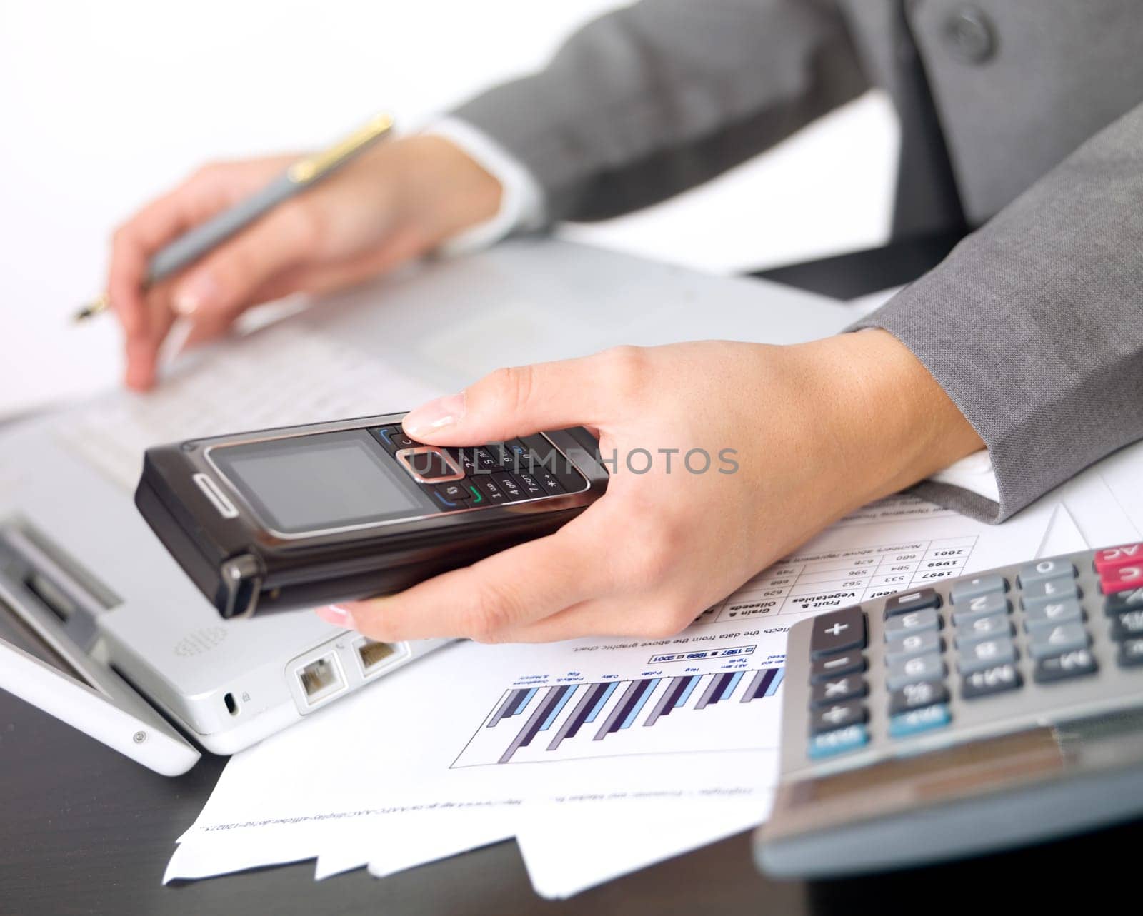 Portrait of beautiful and young business woman working on laptop