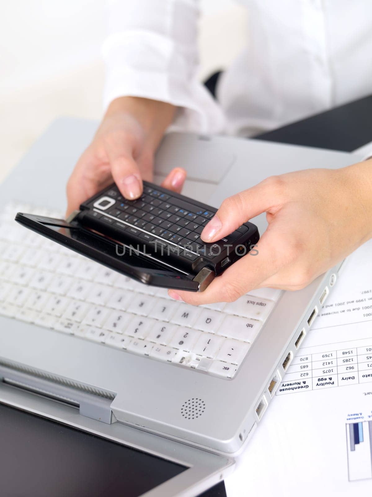 Portrait of beautiful and young business woman working on laptop