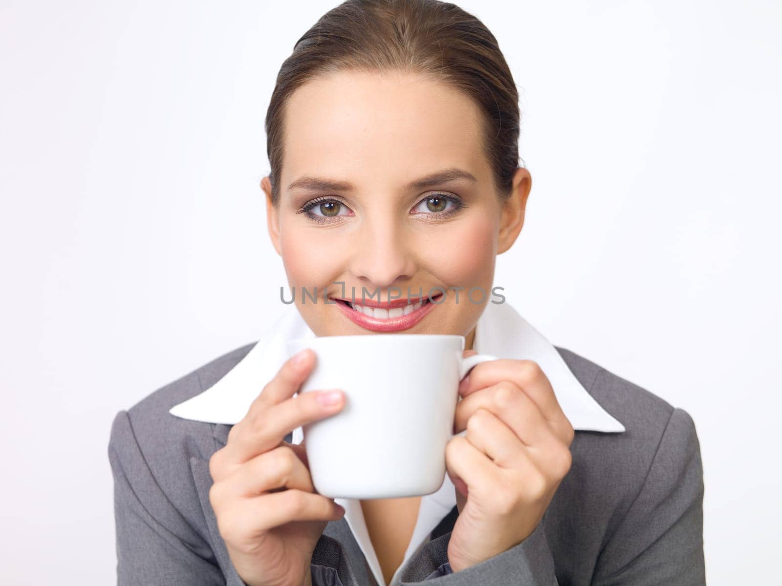 Portrait of beautiful and young business woman with coffee cup